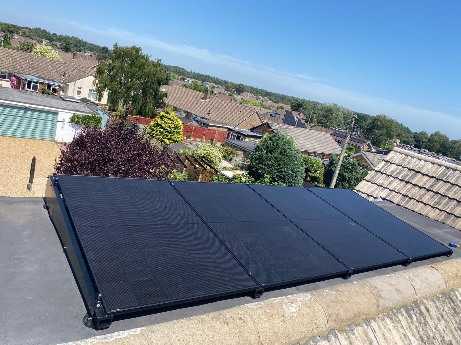Flat roof solar panel mounting system on a residential building