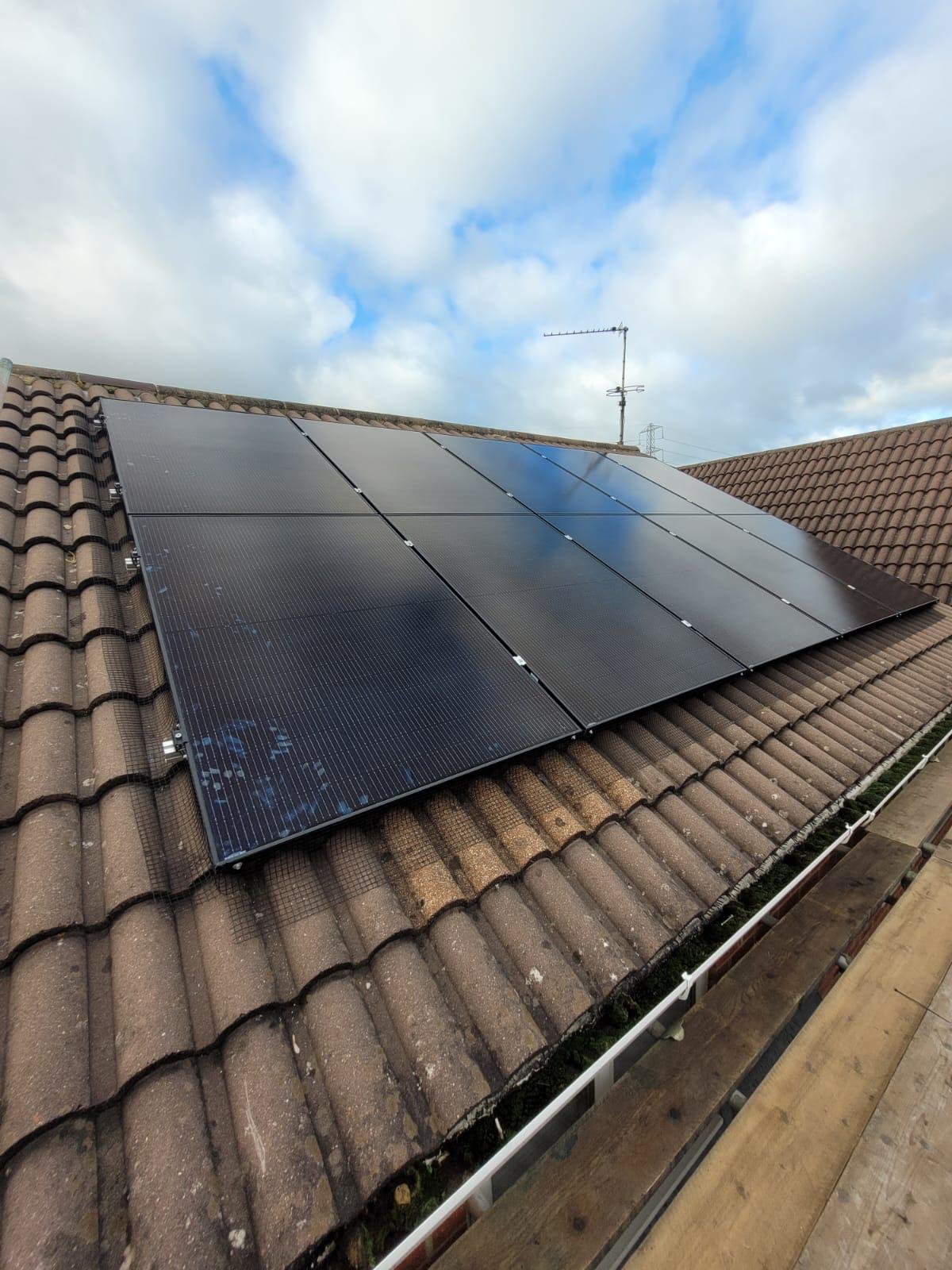 All-black solar panel array on a pantile roof in Hampshire