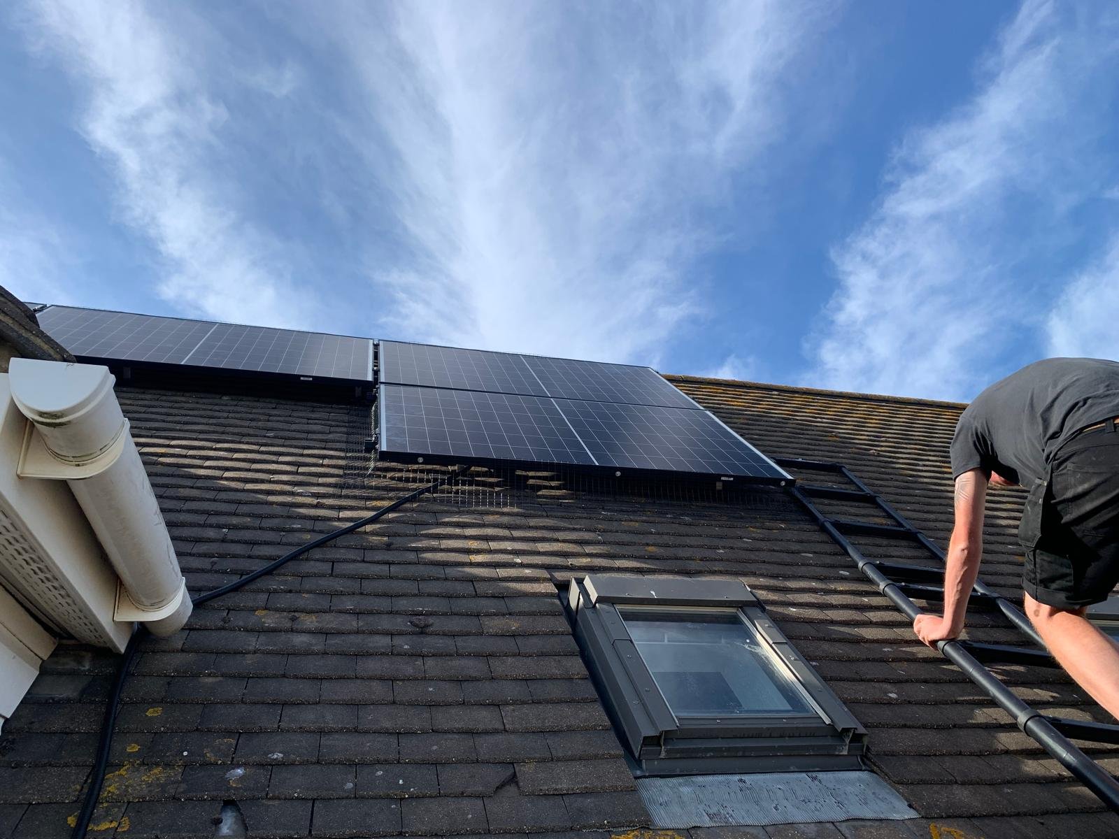 Roof access ladder to a steep solar panel installation in Winchester