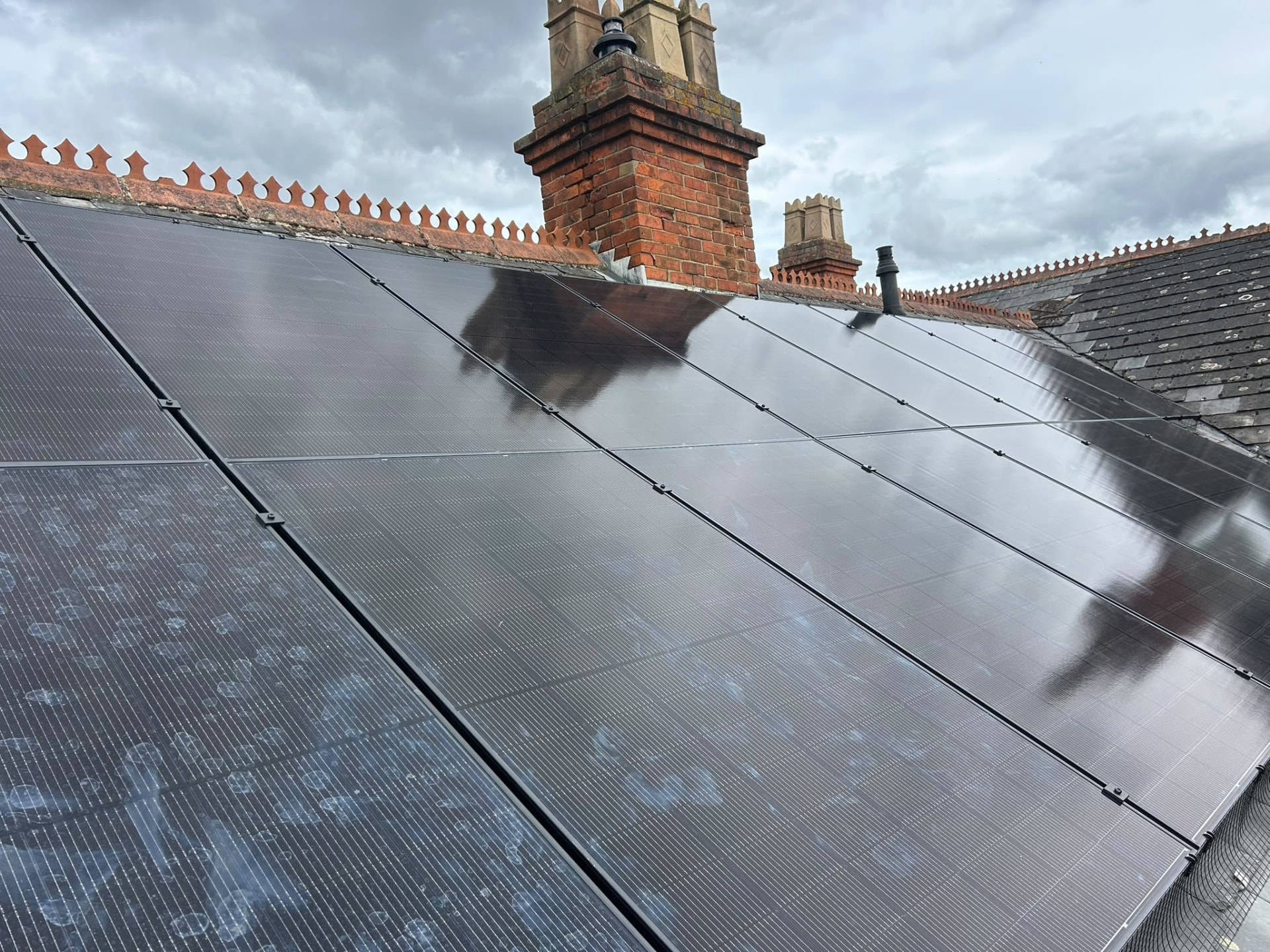All-black solar panels installed across a period slate roof in Hampshire