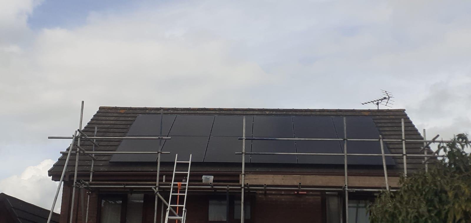 Solar panel installation with scaffolding on a Winchester property