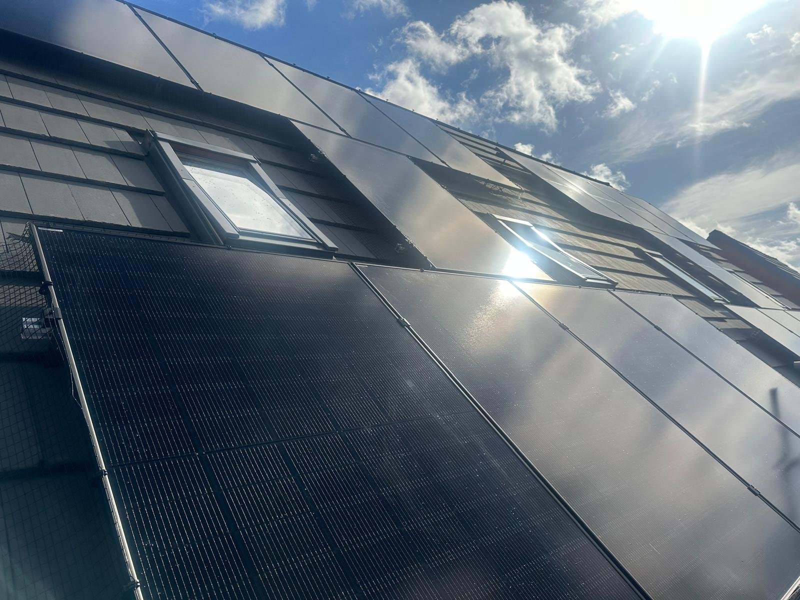 Solar PV array catching direct sunlight on a Hampshire home